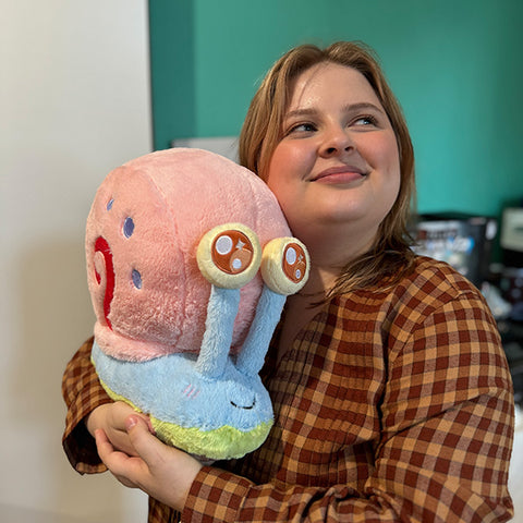 Image shows a woman holding the stuffed Gary. It is about the size of her chest.