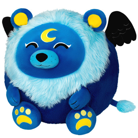 A plush toy resembling a blue lion with white fur accents, black wings, and yellow details on its face and paws. It has a sleeping expression with stars and a crescent moon around its head.