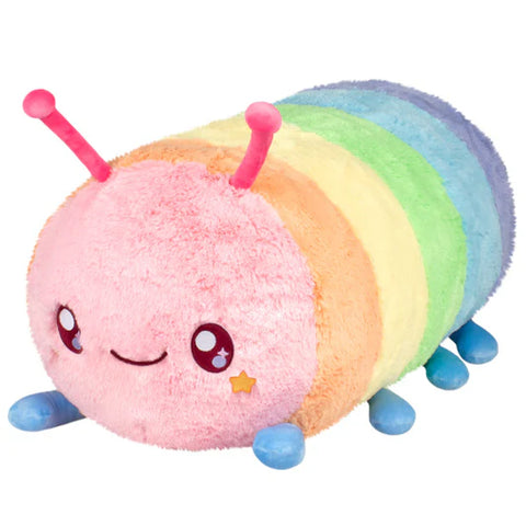 Image shows a large stuffed pastel rainbow-colored caterpillar