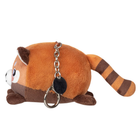 Image shows a side view of the red panda keychain. It is very round.