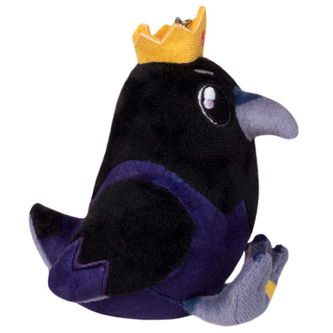 A side view of the plush King Raven keychain