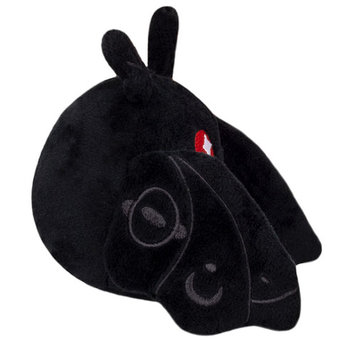 A side view of the plush mothman keychain