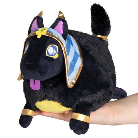 Image shows a black stuffed Anubis from Egyptian mythology. Its body is round.