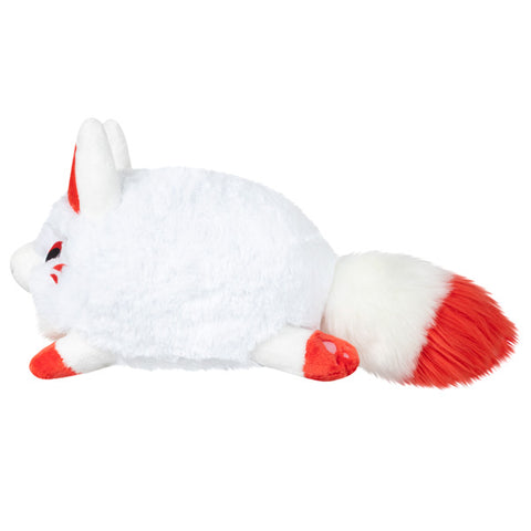 A side view of the plush kitsune