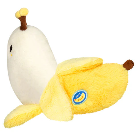Image shows a side view of the stuffed banana slug. The banana has a sticker with the product number on it.