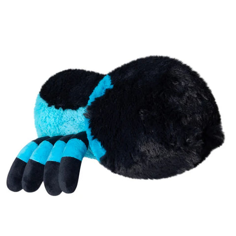 Image shows a side view of the stuffed blue tarantula