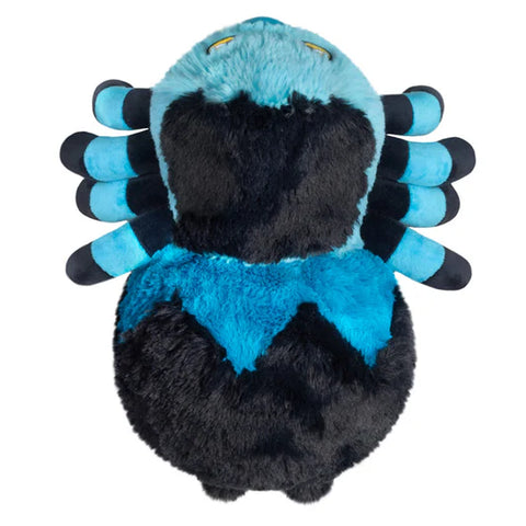 Image shows a top-down view of the stuffed blue tarantula