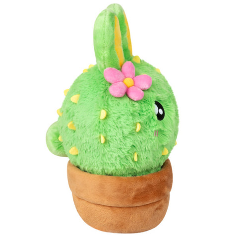 Image shows a side view of the stuffed bunny cactus. It has a small bunny tail.