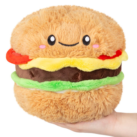 Image shows a stuffed cheeseburger with a smiley face
