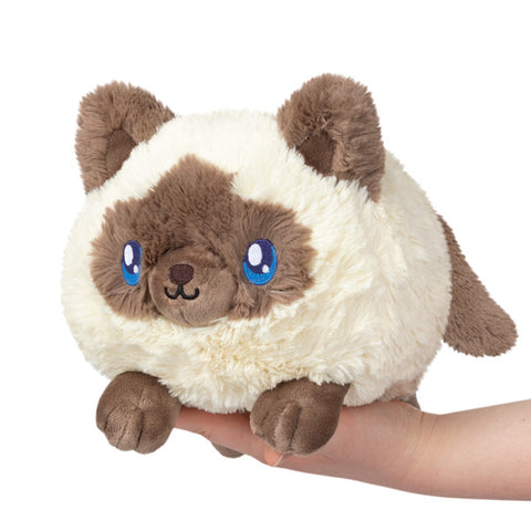 Image shows a stuffed colorpoint kitty, which is cream and brown.