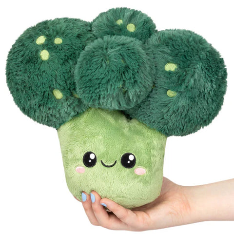 Image shows a stuffed broccoli with a happy face and rosy cheeks