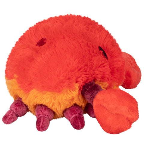 Image shows a side view of the stuffed crab. Its body is round.