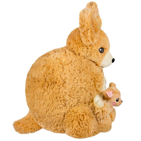 Image shows a side view of the stuffed kangaroo. It is very round.