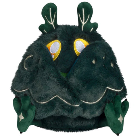 The dark forest mothman with his wings closed in front of his face