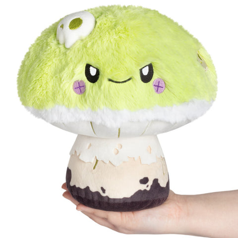 Image shows a stuffed deathcap mushroom with a grumpy face.