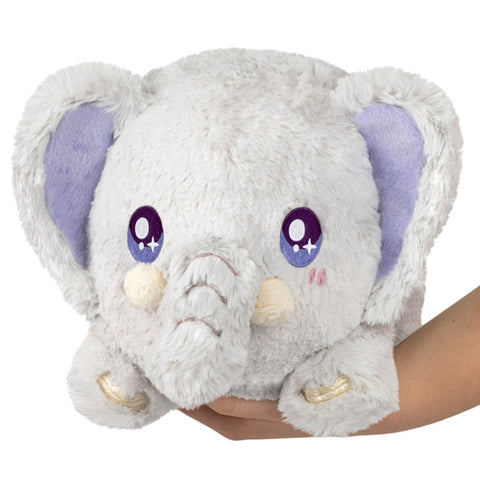 Image shows a stuffed grey elephant with purple inside its ears