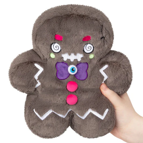 Image shows a stuffed dark brown evil gingerbread man