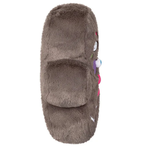 Image shows a side view of the stuffed evil gingerbread man