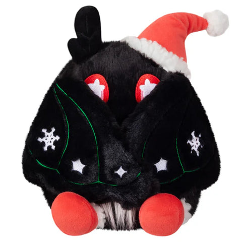 Image shows the festive baby mothman with his wings closed, showing the embroidered snowflakes