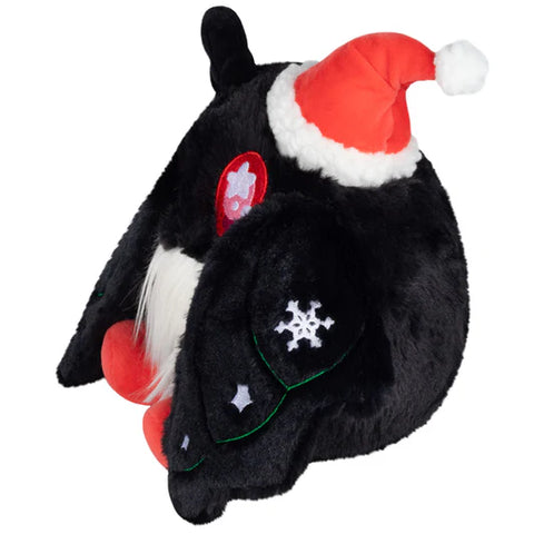 Image shows a side view of the festive baby mothman