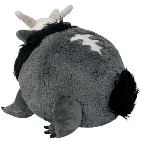 A back-angle view of the plush forest demon. It has a spine-like design on its back.