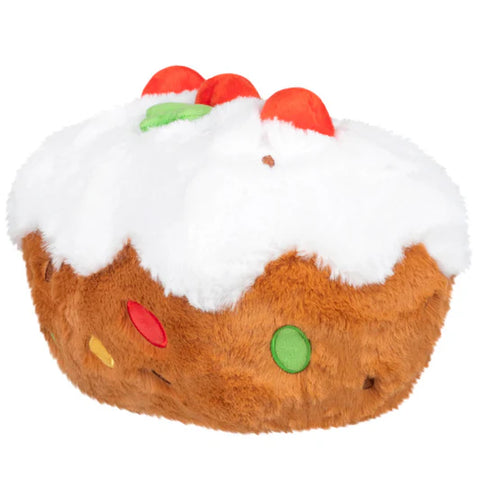 Back view of a plush fruitcake toy on a white background