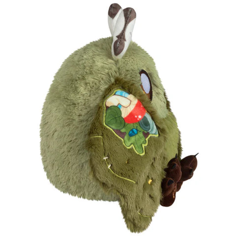 Image shows a side view of the stuffed goblincore baby mothman