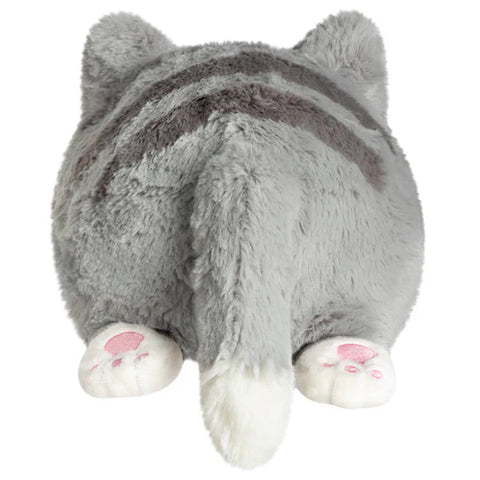 Image shows a back view of the stuffed grey kitty. It has white paws.