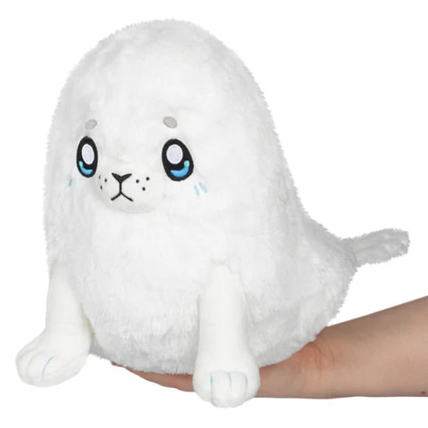 Image shows a white stuffed seal