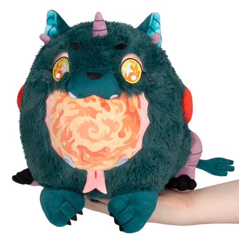 Image shows a stuffed dark teal demon with a wide open mouth with swirling fire in it