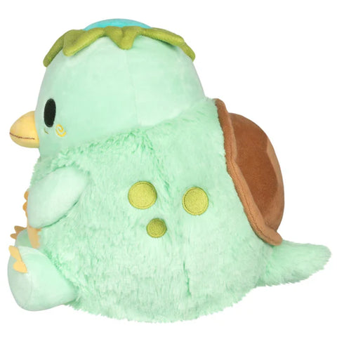 Image shows a side view of the stuffed kappa. Its body is quite round.