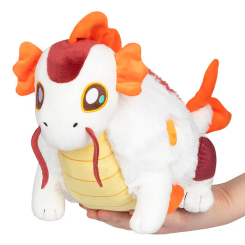 Image shows a stuffed koi fish dragon hybrid. The back half is a koi fish and the front half is a dragon.