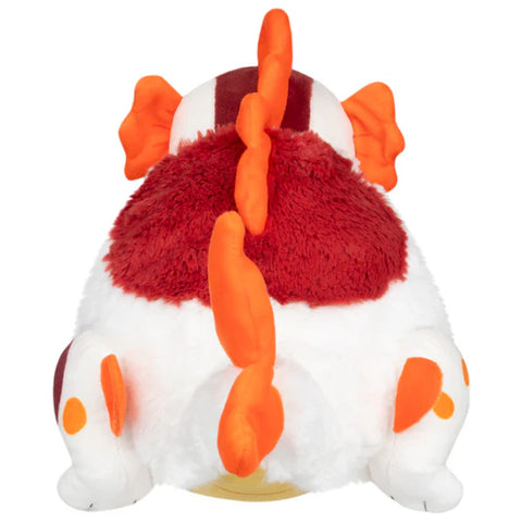 Image shows a back view of the stuffed koi fish dragon. It has spikes that run down its back.