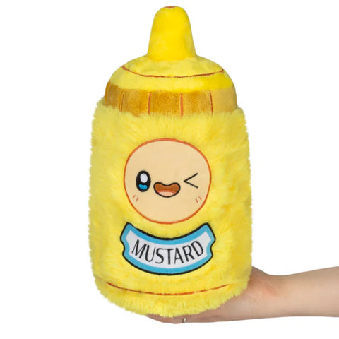 Image shows a stuffed mustard bottle. It has a winking face above the mustard label.