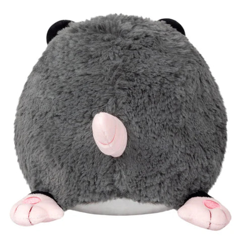 Image shows a back view of the stuffed opossum