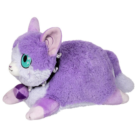 A side view of the lavender cat. It has a black spike collar around its neck.