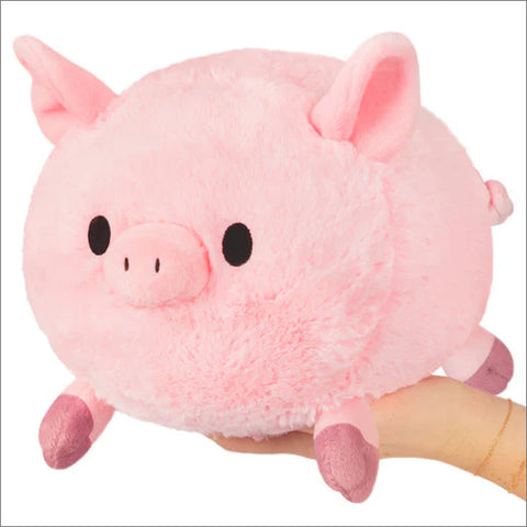 Image shows a round stuffed pink pig with short legs