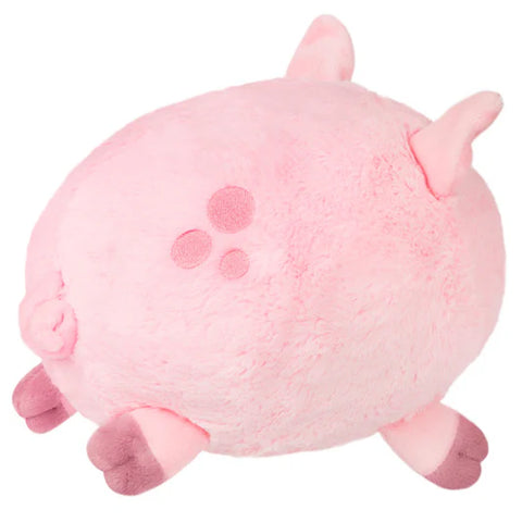 Image shows a side-angle view of the round stuffed pig