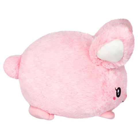 Image shows a side view of the pink stuffed bunny. It is very round.