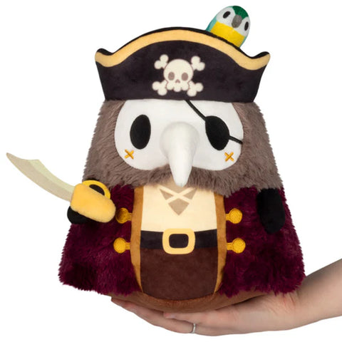 A stuffed plague doctor dressed as a pirate. He has an eye patch, pirate hat, and sword
