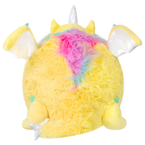 Image shows a back view of the stuffed dragon. The rainbow fur goes down its back slightly.