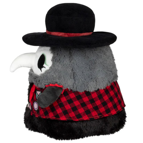 Image shows a side view of the stuffed punk rock plague doctor. He is wearing red plaid.