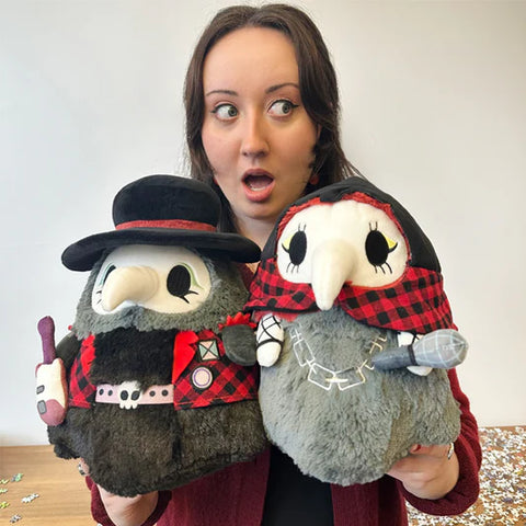 Image shows a woman holding the set. Each is approximately the size of her head.