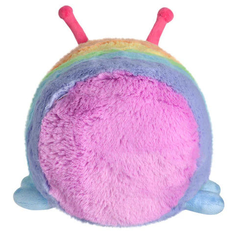 Image shows a back view of the pastel rainbow stuffed caterpillar