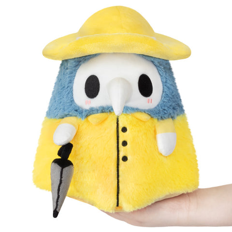 Image shows a stuffed blue plague doctor wearing a yellow raincoat and yellow hat. He is holding a grey umbrella.