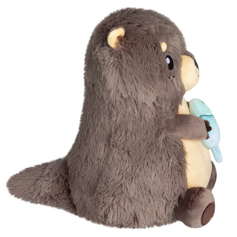 Image shows a side view of the stuffed river otter