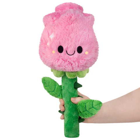 Image shows a stuffed pink rose with a smiley face