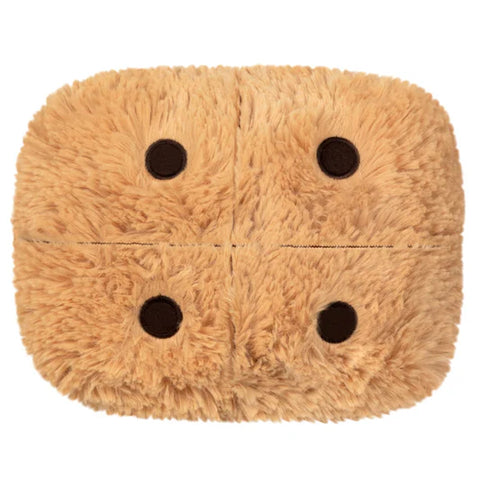 Top-down view of a plush s'mores toy on a white background