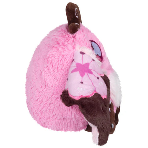 Image shows a side view of the stuffed Sakura-themed baby mothman