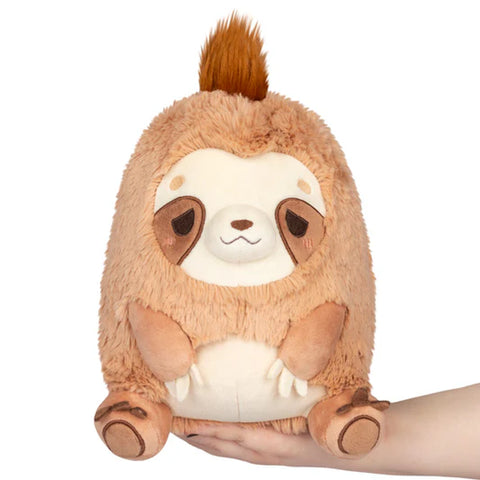 Image shows a stuffed sloth that looks sleepy.